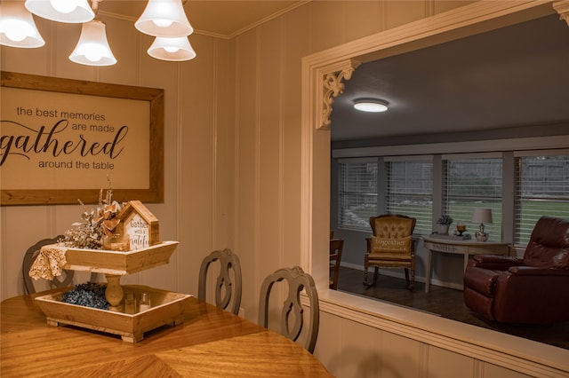 dining space with crown molding