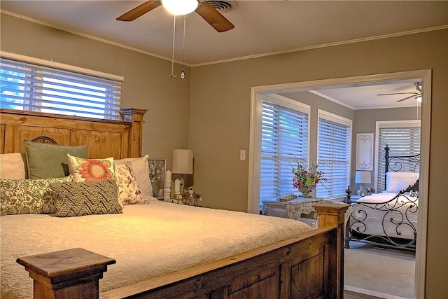 bedroom with crown molding and ceiling fan