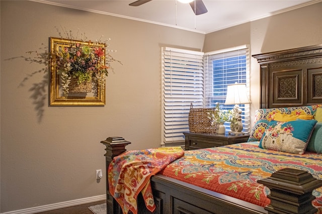 bedroom featuring ceiling fan and ornamental molding