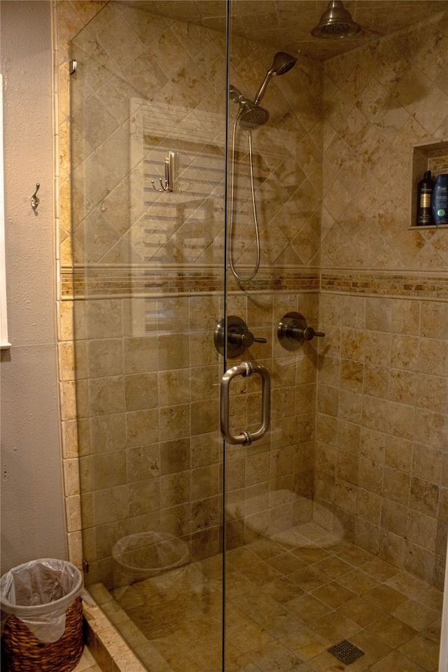 bathroom with a shower with shower door