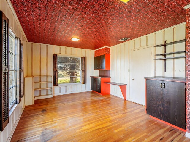 empty room with light hardwood / wood-style flooring