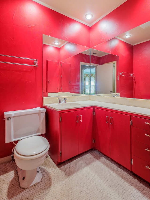 bathroom with a shower, vanity, and toilet