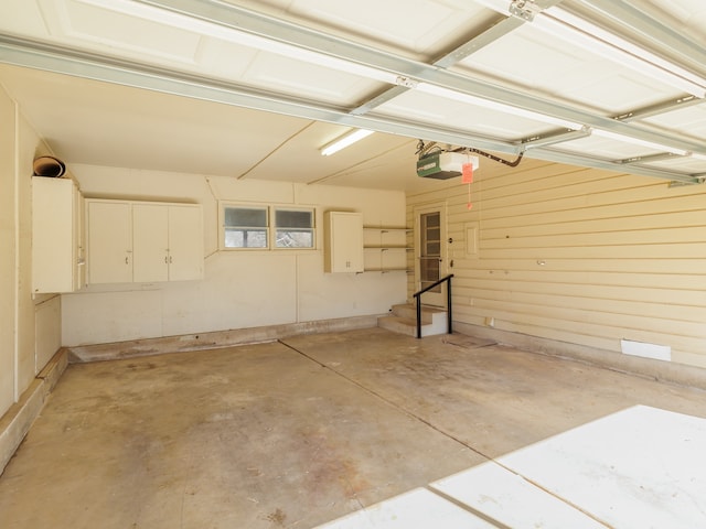 garage featuring a garage door opener