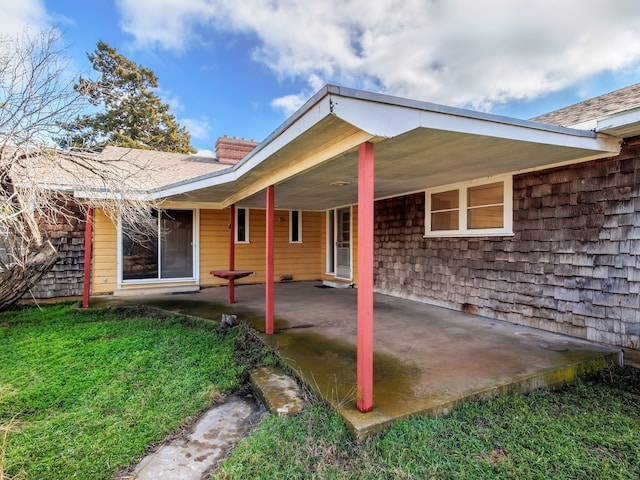 rear view of house featuring a patio