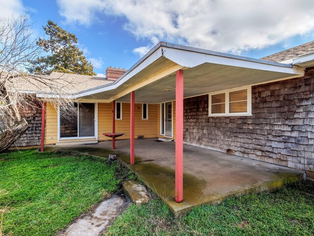 rear view of house featuring a patio