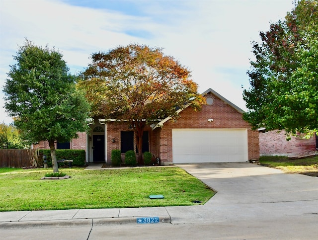 view of property hidden behind natural elements with a front yard and a garage