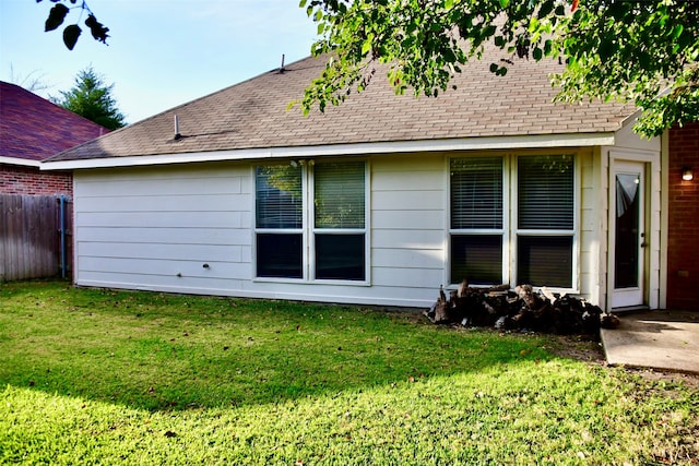 back of house with a yard