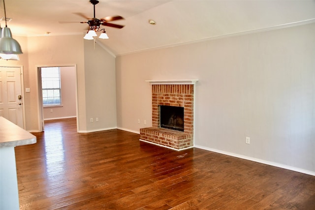 unfurnished living room featuring dark hardwood / wood-style floors, ceiling fan, and ornamental molding