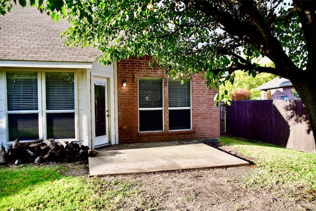 property entrance featuring a patio