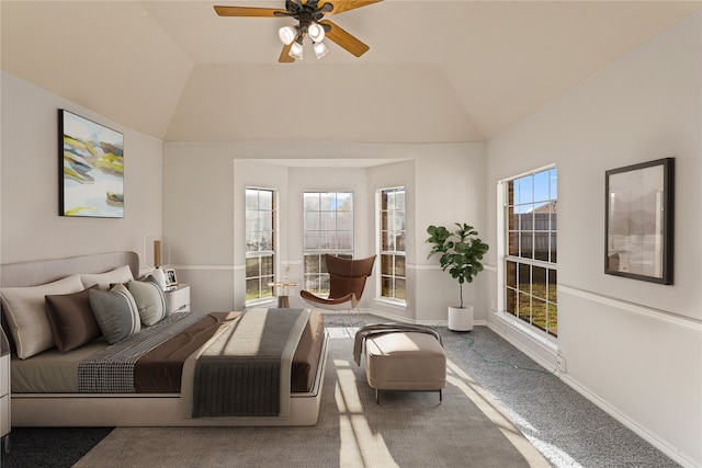 carpeted bedroom featuring ceiling fan and lofted ceiling