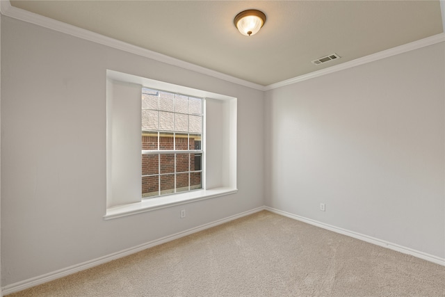 carpeted spare room with crown molding