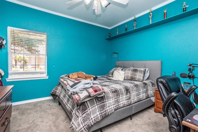 carpeted bedroom with ceiling fan and ornamental molding