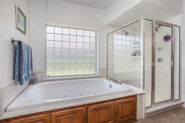 bathroom featuring separate shower and tub and tile patterned flooring