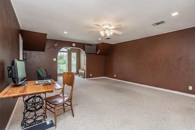 carpeted office with ceiling fan