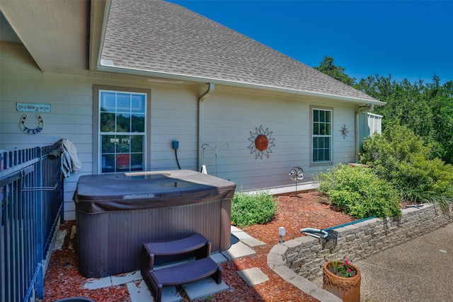 exterior space featuring a hot tub