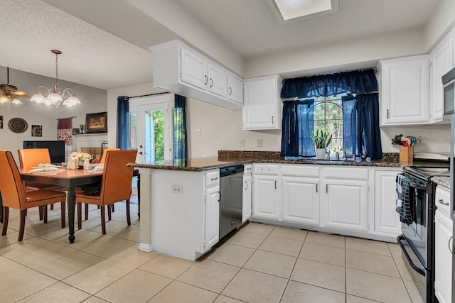 kitchen featuring black electric range oven, stainless steel dishwasher, a notable chandelier, dark stone countertops, and white cabinets