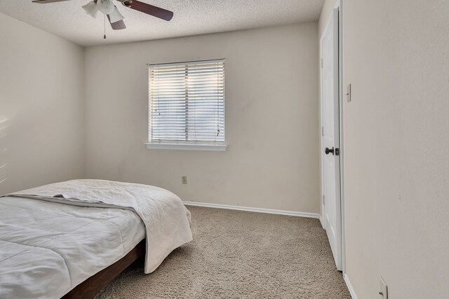 bedroom featuring ceiling fan and carpet floors