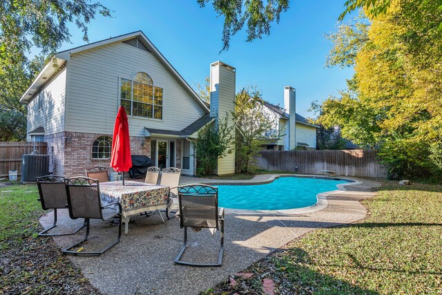 view of pool featuring an in ground hot tub and a patio