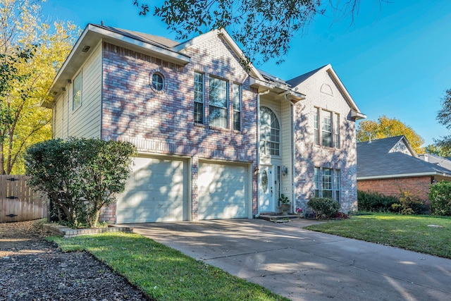 view of front of home featuring a garage and a front yard