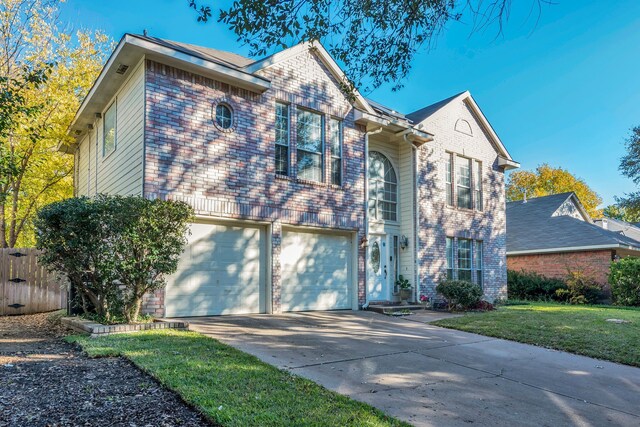 view of front of home featuring a garage and a front lawn