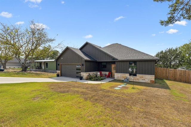 view of front facade with a front lawn and a garage