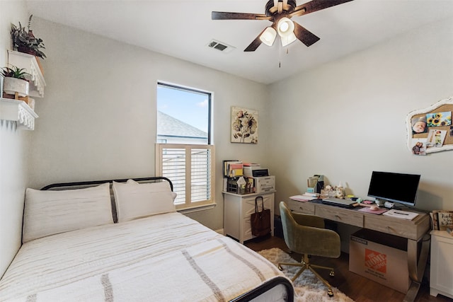 bedroom with ceiling fan and wood-type flooring