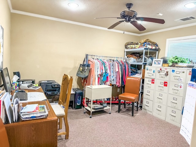 home office with carpet flooring, ceiling fan, a textured ceiling, and ornamental molding