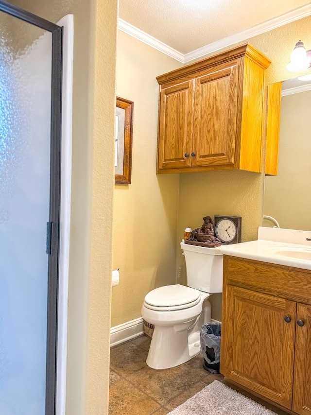 bathroom with vanity, crown molding, tile patterned flooring, toilet, and a textured ceiling