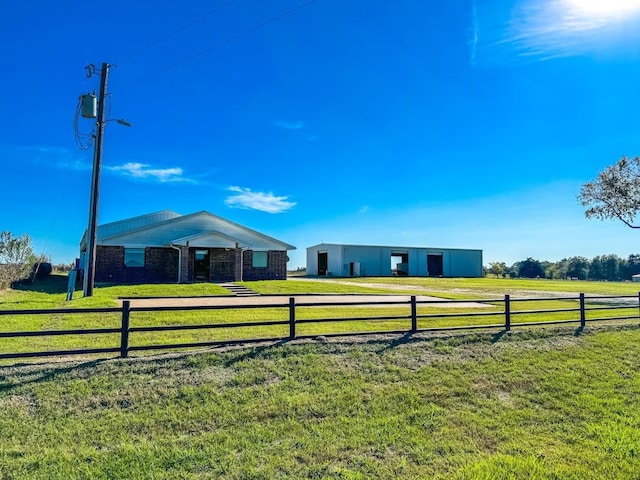 exterior space with an outbuilding and a rural view