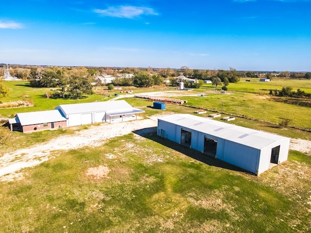 birds eye view of property featuring a rural view