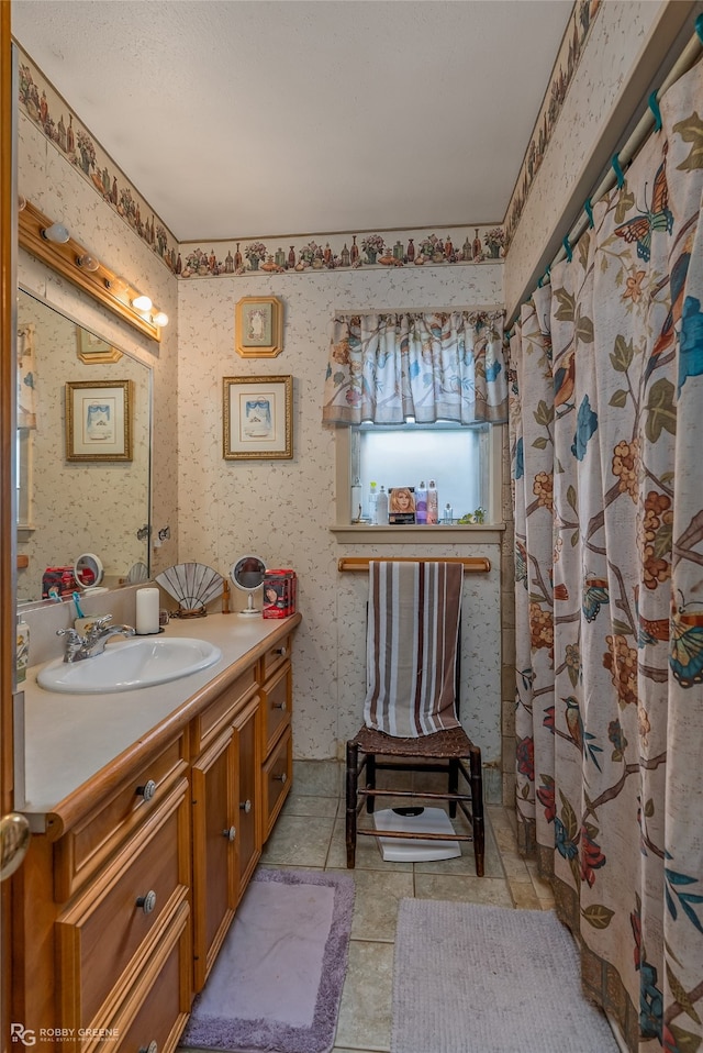 bathroom featuring tile patterned floors and vanity