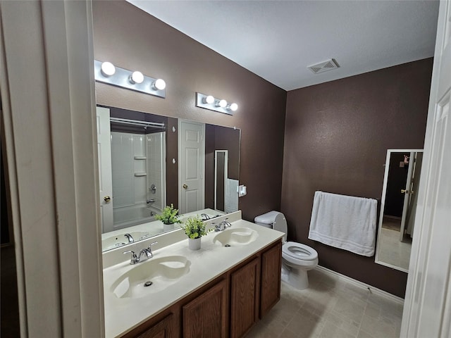 full bathroom featuring shower / tub combination, vanity, and toilet