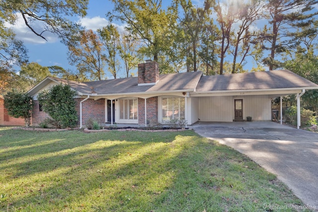 ranch-style house featuring a front lawn and a carport