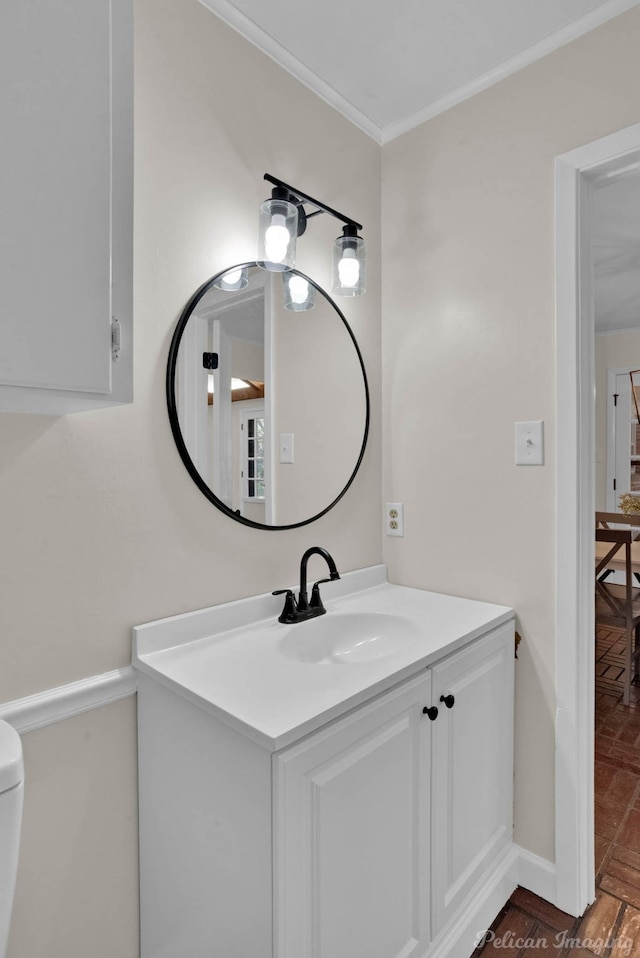 bathroom featuring hardwood / wood-style flooring, vanity, and ornamental molding