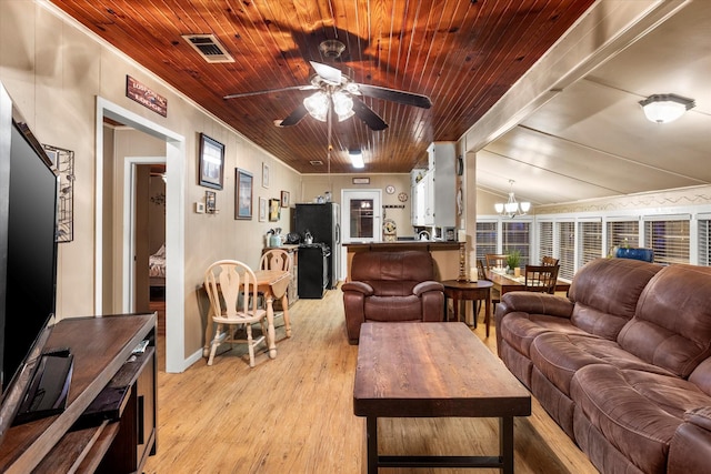 living room with vaulted ceiling with beams, wood ceiling, ceiling fan with notable chandelier, and light hardwood / wood-style floors