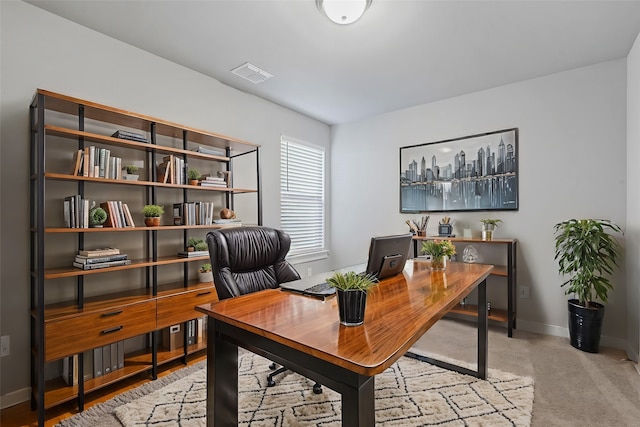 view of carpeted office space