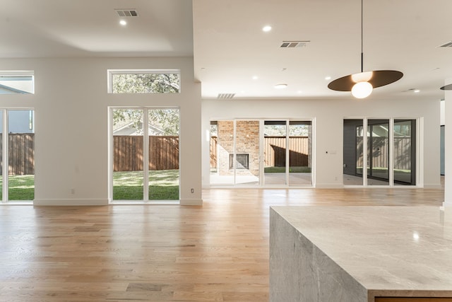 unfurnished living room with light hardwood / wood-style floors