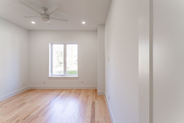 unfurnished room with ceiling fan and light hardwood / wood-style flooring