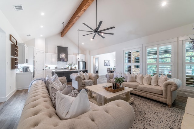 living room featuring beam ceiling, ceiling fan, high vaulted ceiling, and light hardwood / wood-style floors