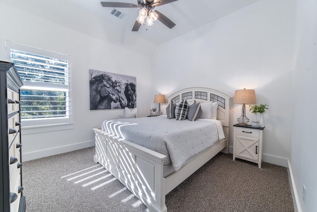 bedroom featuring dark colored carpet, ceiling fan, and lofted ceiling