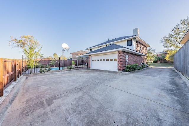 view of property exterior featuring a garage