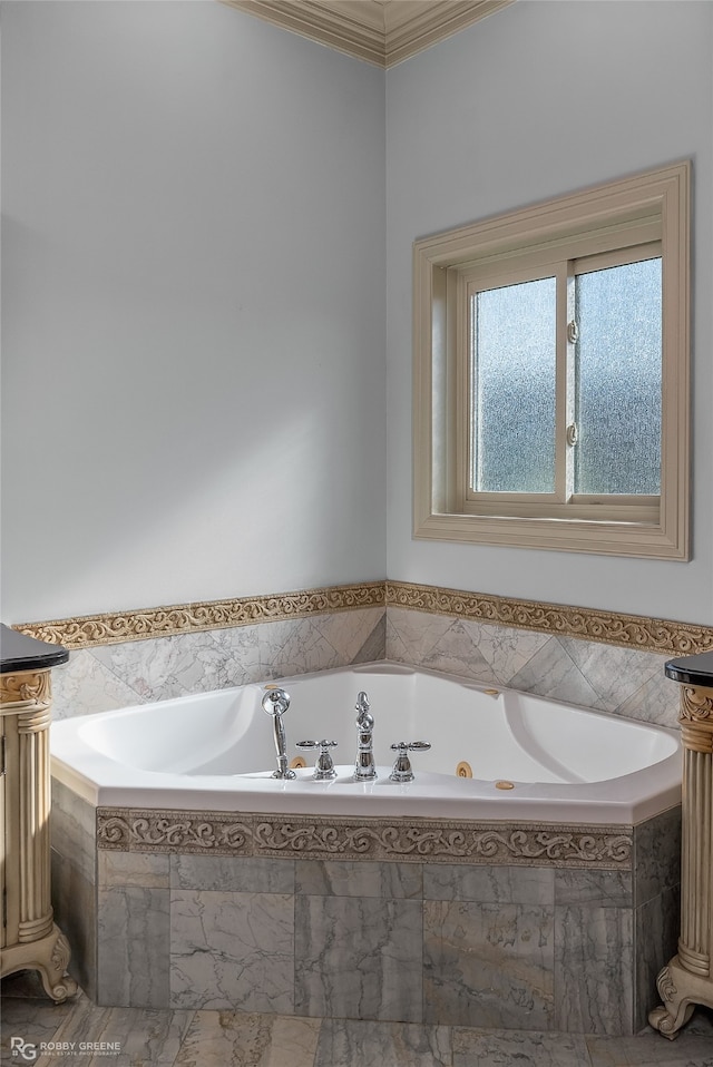 bathroom featuring crown molding and tiled bath