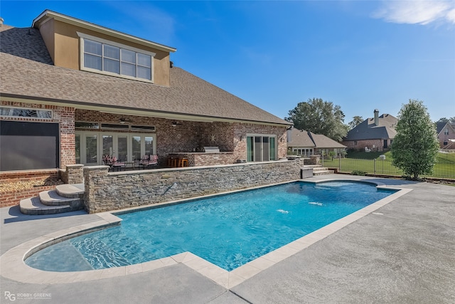 view of swimming pool with a patio area and ceiling fan