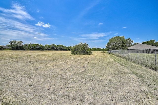 view of yard with a rural view