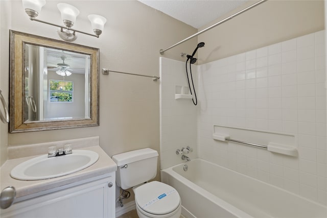 full bathroom with vanity, ceiling fan, toilet, a textured ceiling, and shower / bathtub combination