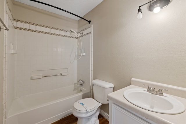 full bathroom featuring hardwood / wood-style floors, vanity, bathtub / shower combination, and toilet