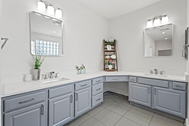full bathroom featuring tile patterned floors and vanity