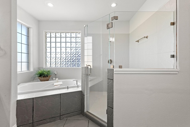 full bath featuring a shower stall, recessed lighting, a bath, and tile patterned flooring
