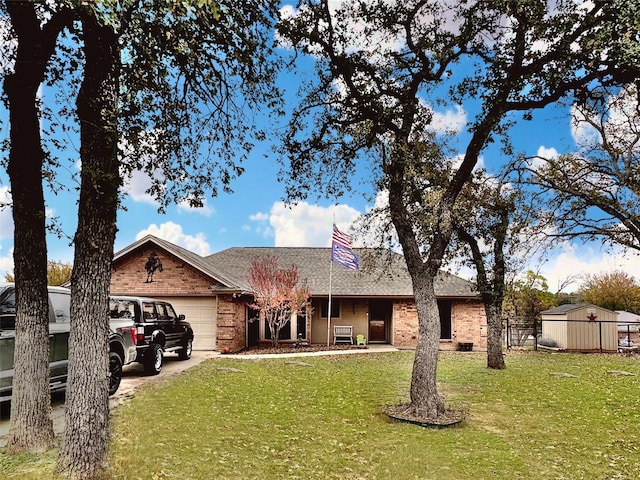 single story home featuring a front yard and a garage