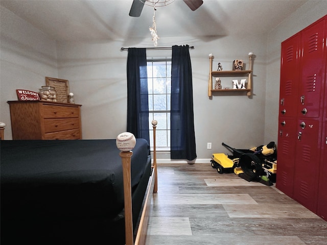 bedroom with hardwood / wood-style flooring and ceiling fan